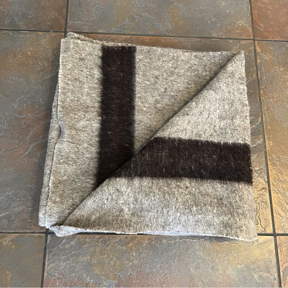 Gray-brownish with Dark Brown stripe at top & bottom of this Wool Blanket